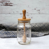 wooden honey dipper lid for mason jars with a cute blue dot towel in the background