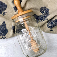 wooden honey dipper lid for regular mouth mason jars on a chicken towel